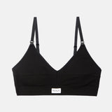 A black ribbed V-neck sports bra with adjustable shoulder straps and a small white brand label at the bottom center, displayed on a light gray background.