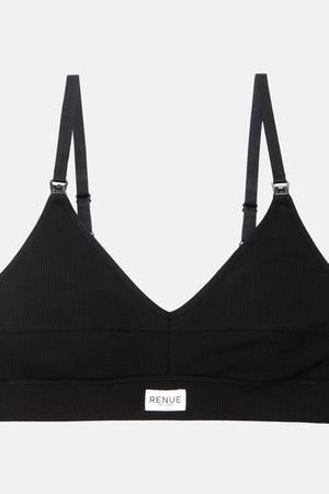 A black ribbed V-neck sports bra with adjustable shoulder straps and a small white brand label at the bottom center, displayed on a light gray background.