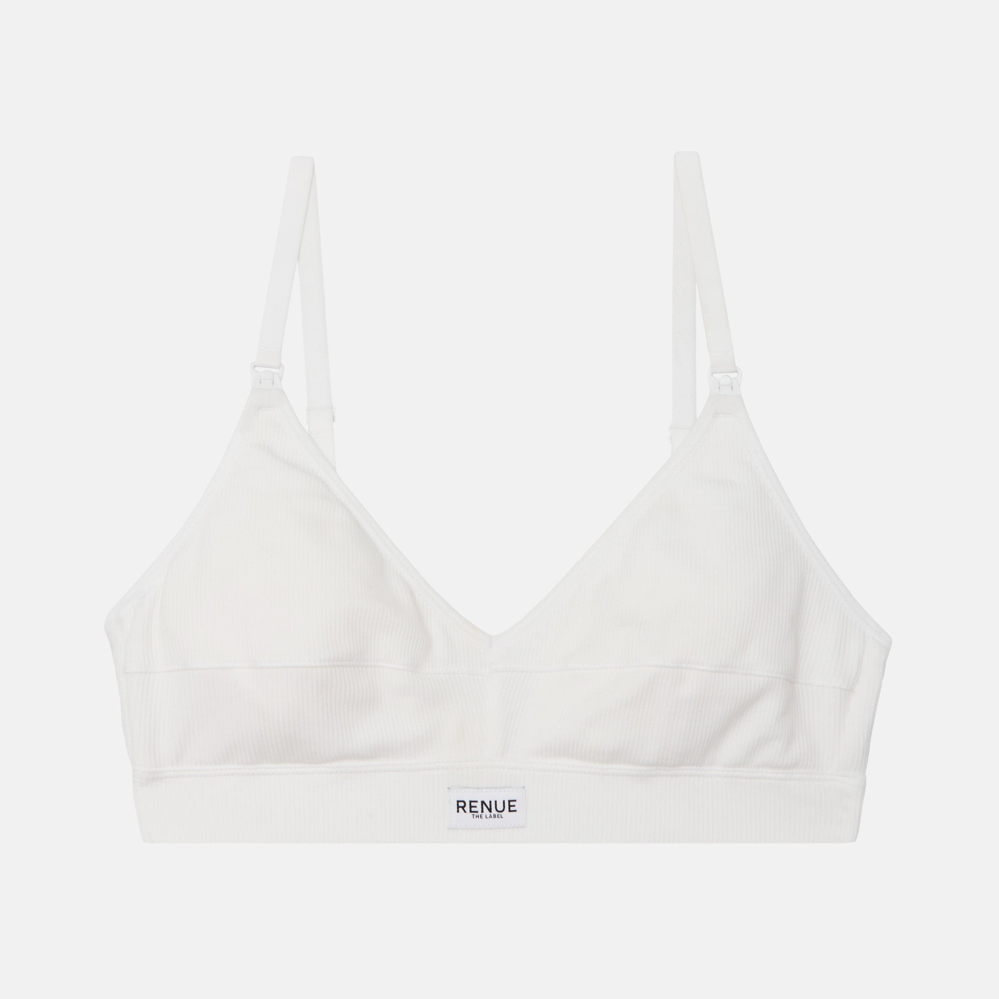 A white wireless bralette with adjustable shoulder straps and a wide underband, featuring the brand name 'RENUE' printed in black on the front center of the band, set against a solid light gray background.
