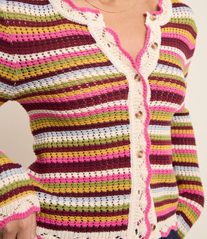 Colorful striped crochet cardigan with button details on a neutral background