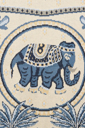Decorative fabric with blue elephant design on a beige background