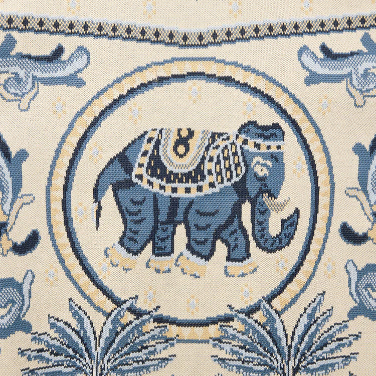 Decorative fabric with blue elephant design on a beige background