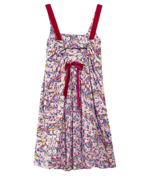A sleeveless floral midi dress with thin red shoulder straps and a matching red bow at the waist, featuring an all-over multicolor floral print on a light background.