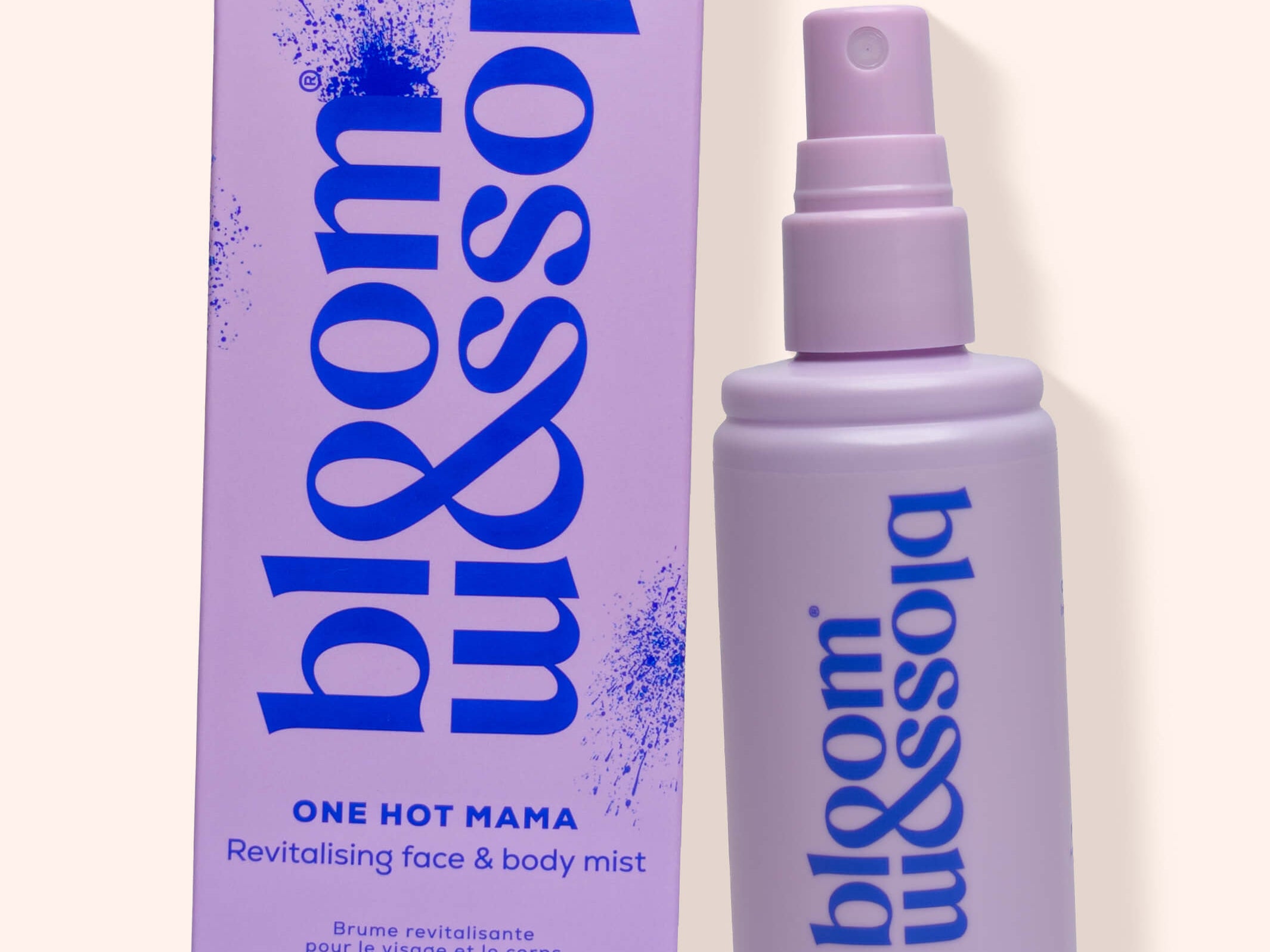 A lavender spray bottle and matching box for bloom missolia One Hot Mama Revitalising Face & Body Mist, set against a solid pale cream background.