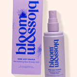 A lavender spray bottle and matching box for bloom missolia One Hot Mama Revitalising Face & Body Mist, set against a solid pale cream background.