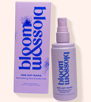 A lavender spray bottle and matching box for bloom missolia One Hot Mama Revitalising Face & Body Mist, set against a solid pale cream background.