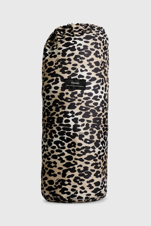 Thoren Eco Playmat in Leopard rolled up inside its drawstring bag, front view with small black label