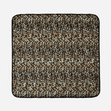Thoren Eco Playmat in Leopard, flat top-down view of the quilted square mat with black edging