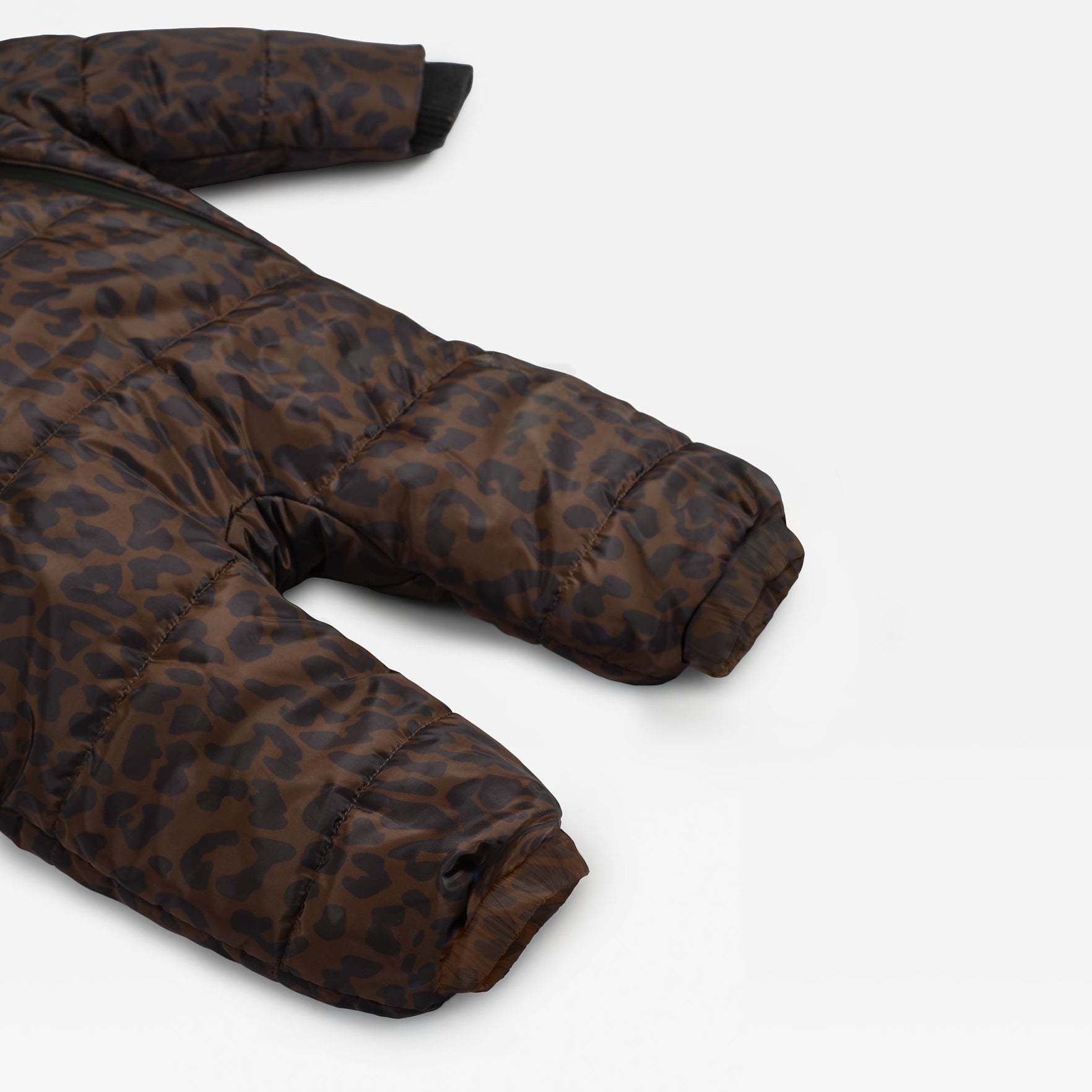 ANDERS Eco Snowsuit Chocolate Leopard close-up of the quilted sleeve and leg with ribbed cuffs, laid flat