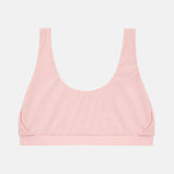 A light pink scoop-neck bralette with wide shoulder straps and a wide underband, shown flat against a light gray background.