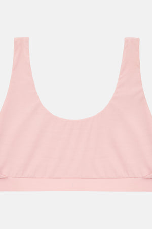 A light pink scoop-neck bralette with wide shoulder straps and a wide underband, shown flat against a light gray background.