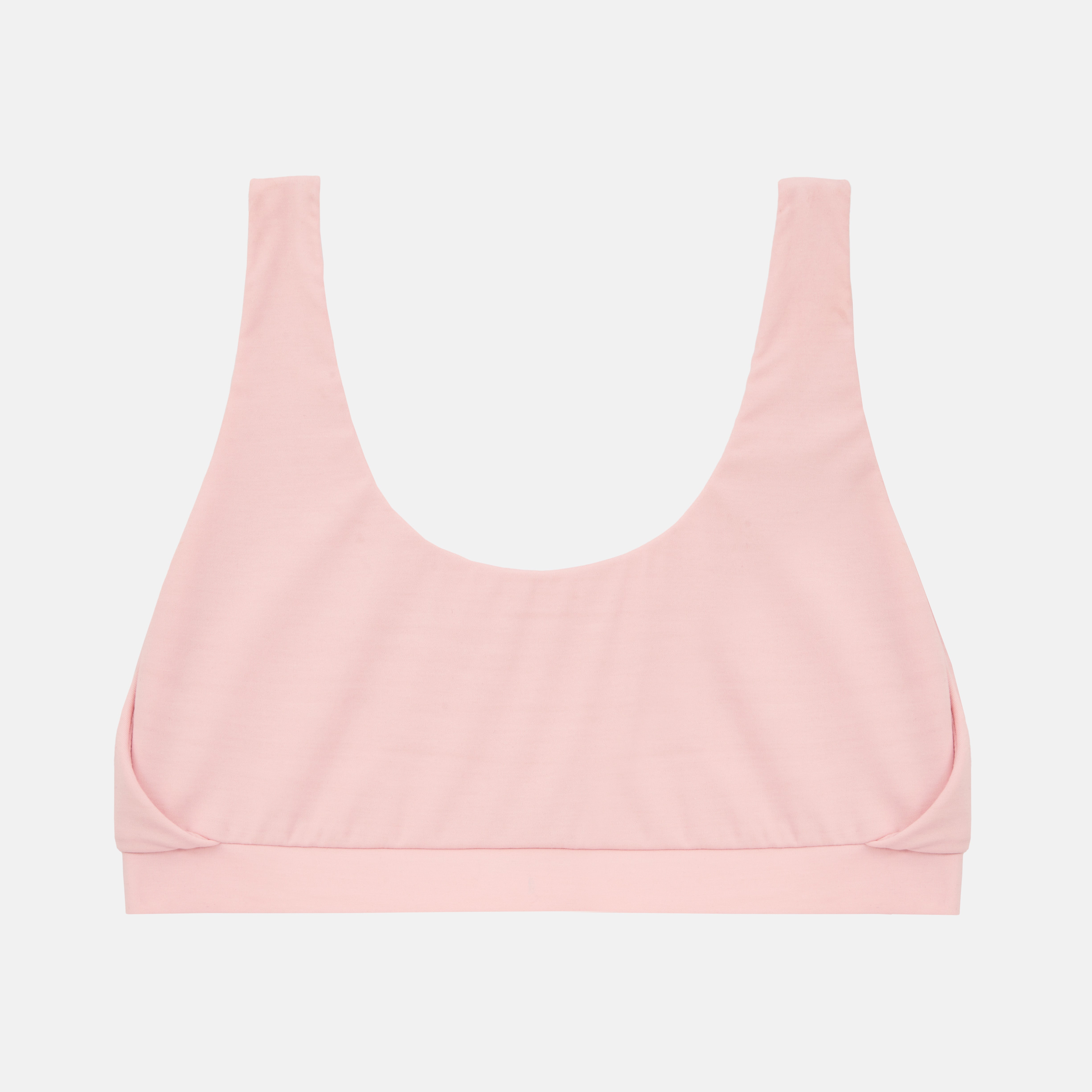 A light pink scoop-neck bralette with wide shoulder straps and a wide underband, shown flat against a light gray background.