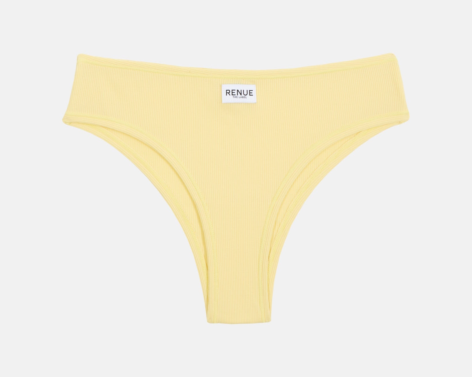 A pale yellow ribbed bikini bottom with a small white brand label reading 'RENUE' at the center waistband, shown flat against a light gray background.