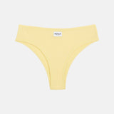 A pale yellow ribbed bikini bottom with a small white brand label reading 'RENUE' at the center waistband, shown flat against a light gray background.