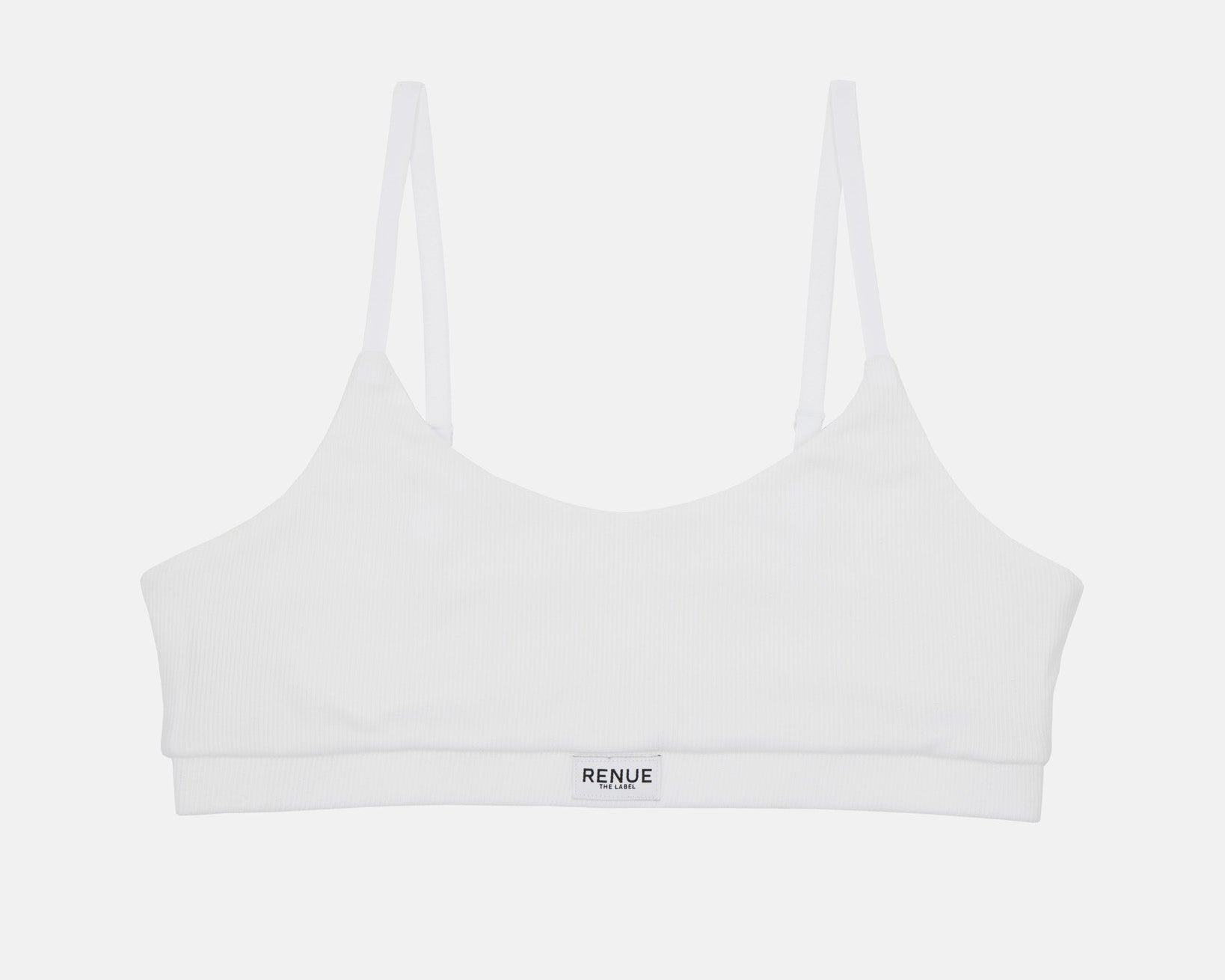 A white sports bra with thin shoulder straps and a small black 'RENUE' logo on the front underband, shown against a light gray background.