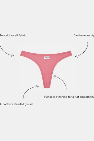 Pink thong underwear centered on a light gray background with four callout arrows and text describing fabric, rise options, and gusset construction.