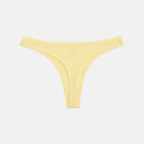 A pale yellow ribbed bikini bottom with a low-rise silhouette, photographed flat against a light gray background.