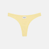 A pale yellow thong-style bikini bottom with a small white brand label reading RENUE at the center front, shown on a plain light gray background.