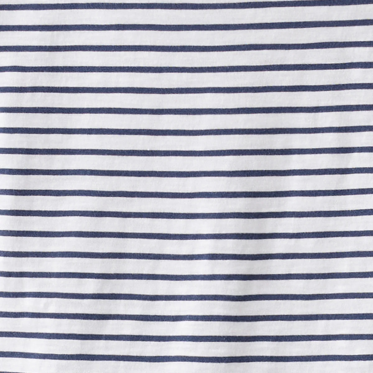Close-up of white fabric with blue horizontal stripes