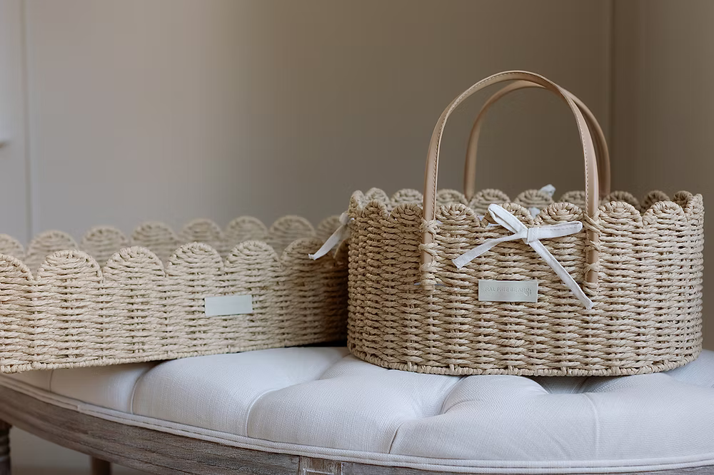 Ralphie Bear scallop edge baby changing basket in neutral tones with curved edges and woven texture.