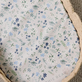 Ralphie Bear scallop edge baby changing basket in neutral tones with curved edges and woven texture.