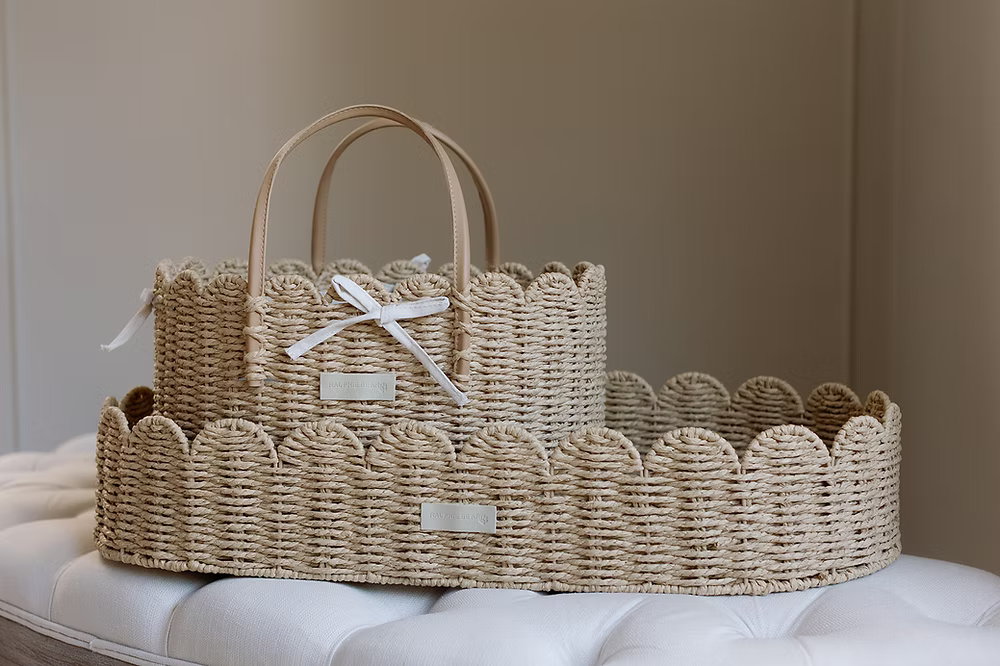 Ralphie Bear scallop edge baby changing basket in neutral tones with curved edges and woven texture.