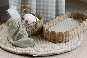Ralphie Bear scallop edge baby changing basket in neutral tones with curved edges and woven texture.