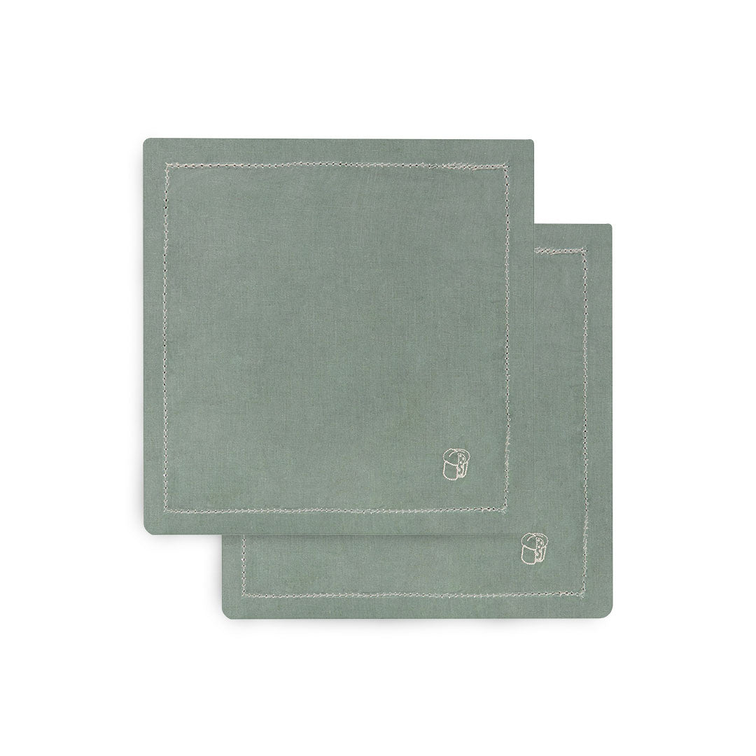 Two green placemats with a brand logo on a white background