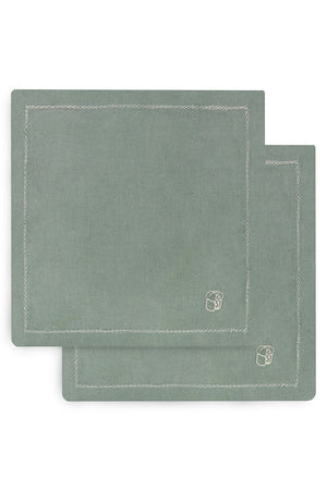 Two green placemats with a brand logo on a white background