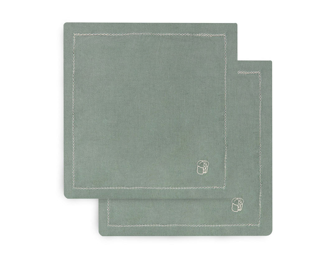 Two green placemats with a brand logo on a white background
