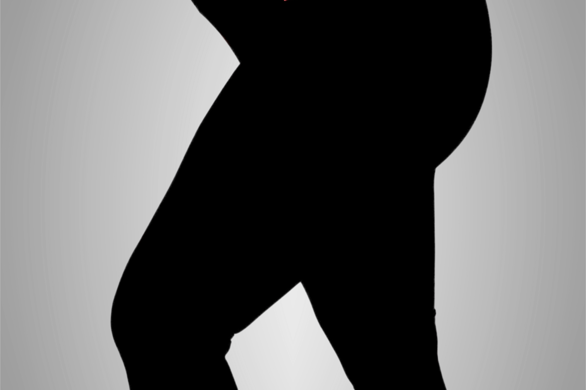 Black leggings with brand logos on a gray background