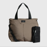 Sigrid Eco Changing Bag in Mocha, front view with top handles, crossbody strap and black changing mat beside it