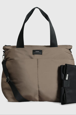 Sigrid Eco Changing Bag in Mocha, front view with top handles, crossbody strap and black changing mat beside it