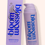 A lavender pump bottle and matching rectangular box for bloom & soia Smooth Moves Stretch mark oil, shown on a warm off-white background.