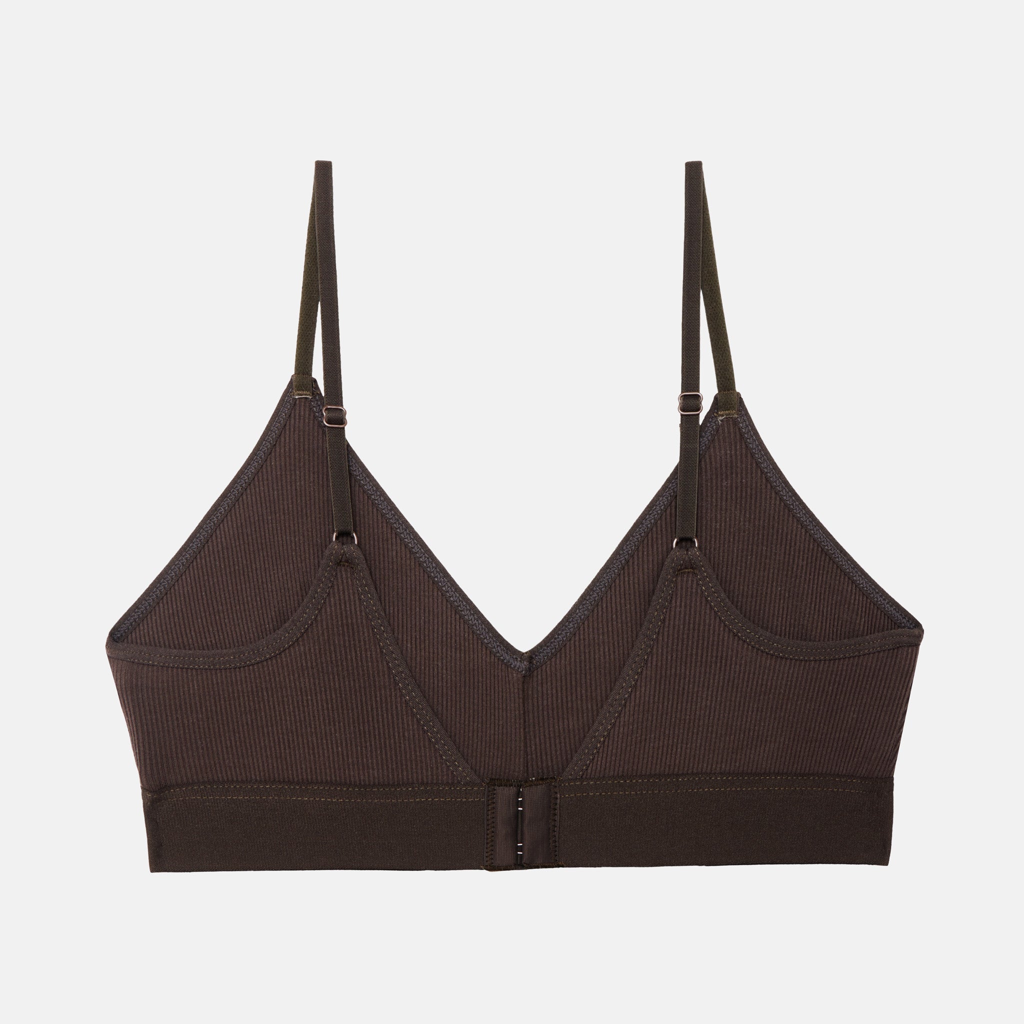 A dark brown ribbed wireless bralette with thin adjustable shoulder straps and a center front closure, shown flat against a light gray background.