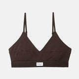 A dark brown ribbed wireless bralette with thin adjustable shoulder straps and a small white rectangular brand label reading 'RENUE' on the underband, shown against a light gray background.