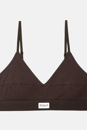 A dark brown ribbed wireless bralette with thin adjustable shoulder straps and a small white rectangular brand label reading 'RENUE' on the underband, shown against a light gray background.