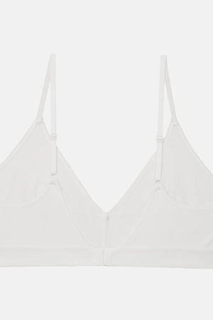 A white wireless triangle bralette with thin adjustable shoulder straps and a center front closure, shown flat against a light gray background.