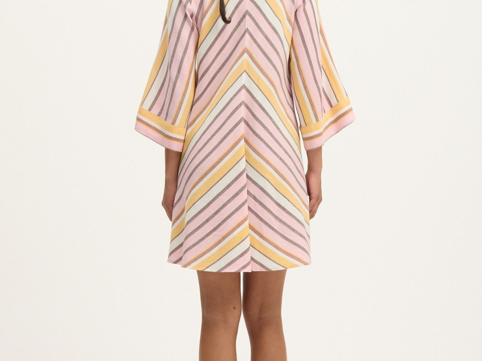 Back view of Summery Copenhagen Martha Mini Dress in Pink Mist with fluted sleeves and V neckline