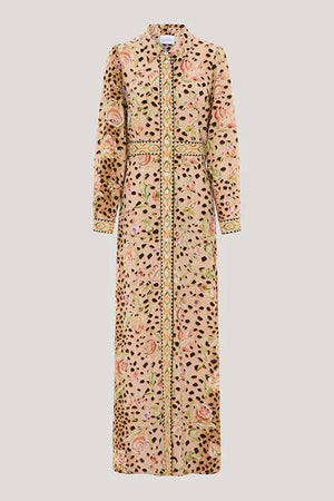 A long-sleeved maxi shirt dress with a mixed print of leopard spots, pink roses, and green leaves on a beige base, featuring a gold patterned trim down the front and cuffs.