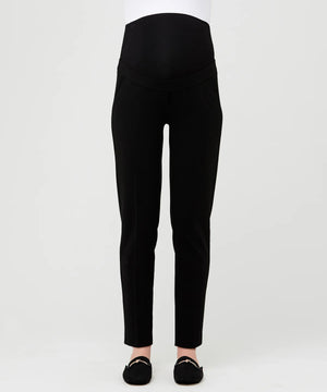 Black pants worn by a person on a white background