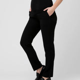 Person wearing black pants on a white background