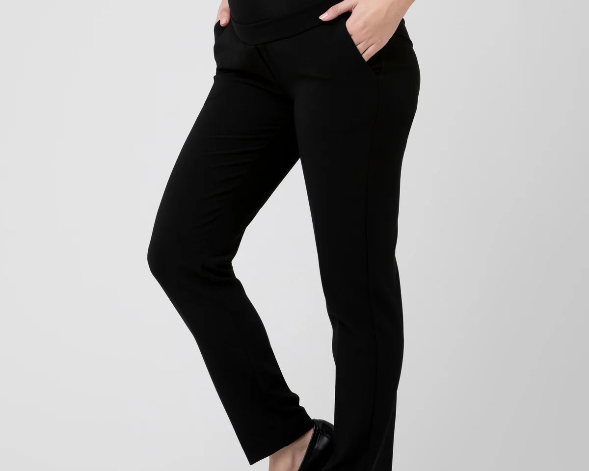 Person wearing black pants on a white background