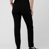 Person wearing black pants on a white background