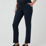 Navy blue maternity pants worn by a person on a white background