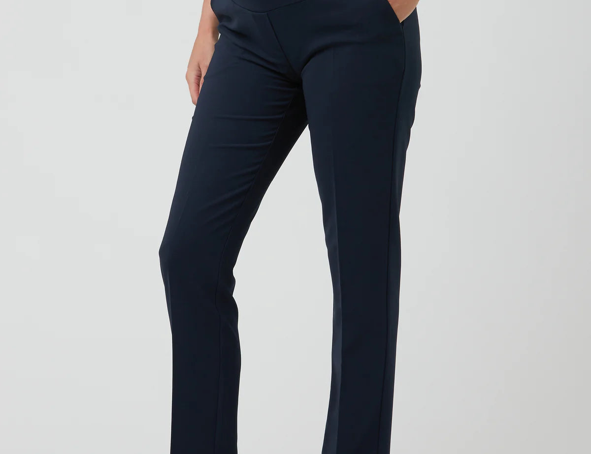 Navy blue maternity pants worn by a person on a white background