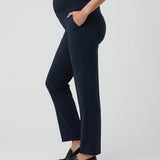 Navy blue pants worn by a person on a light gray background