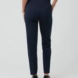 Navy blue pants worn by a person on a white background