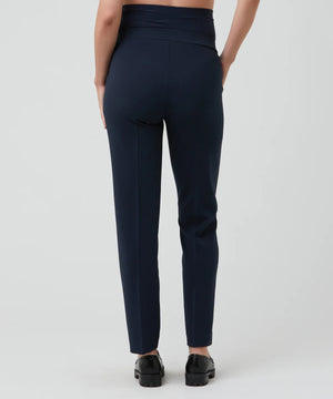 Navy blue pants worn by a person on a white background