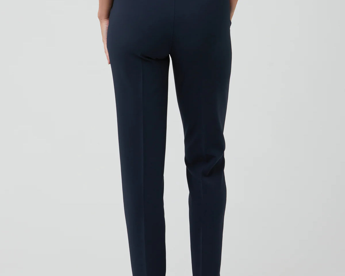 Navy blue pants worn by a person on a white background
